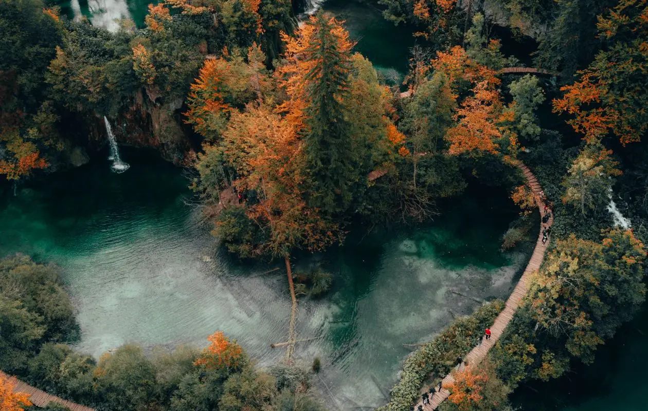 Nature background, Nature wallpaper, Lush green forested mountains surround a vibrant turquoise lake with cascading waterfalls